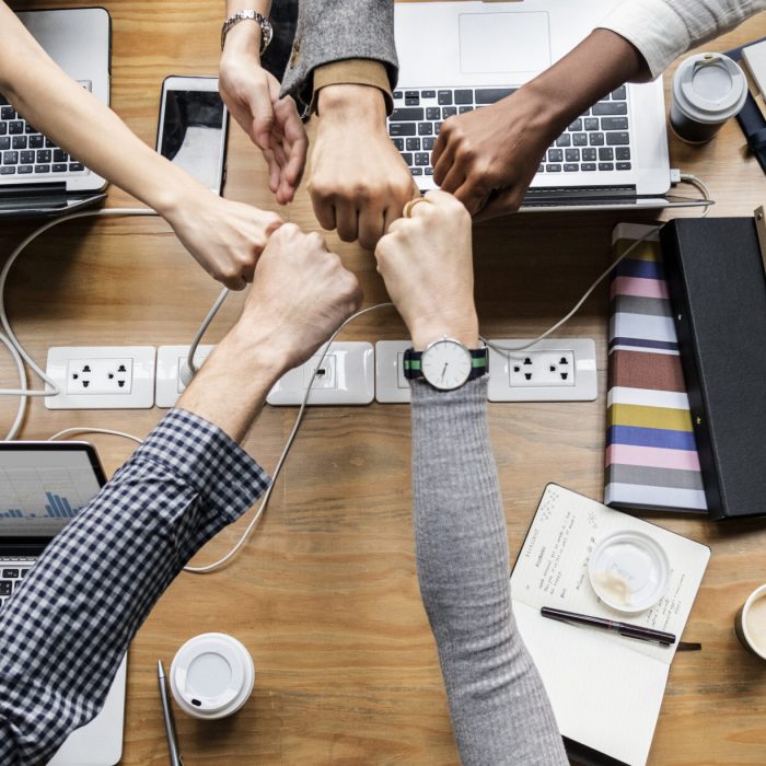 Colleagues giving a fist bump Colleagues giving a fist bump